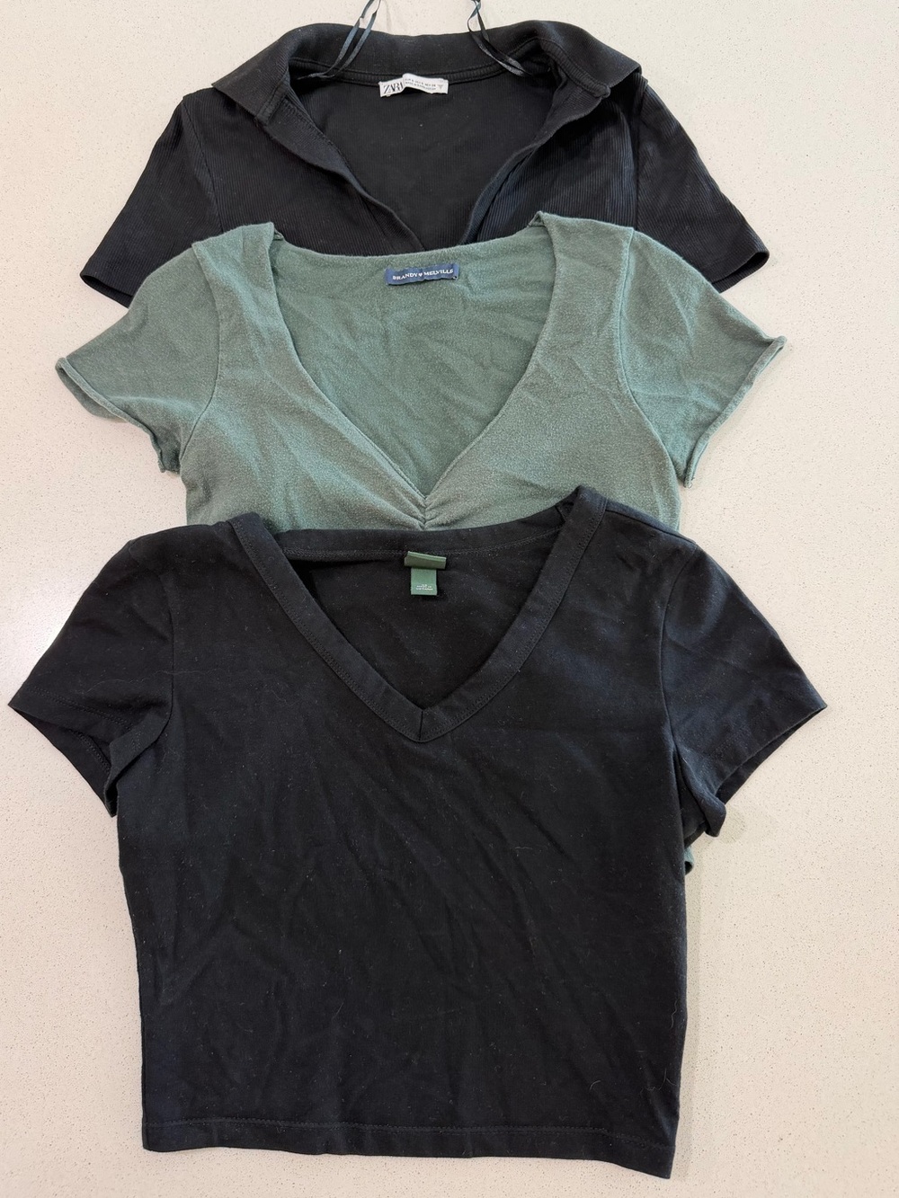 Wild Fable, Zara and Brandy Melville 3-pack of black & green cotton t-shirts.